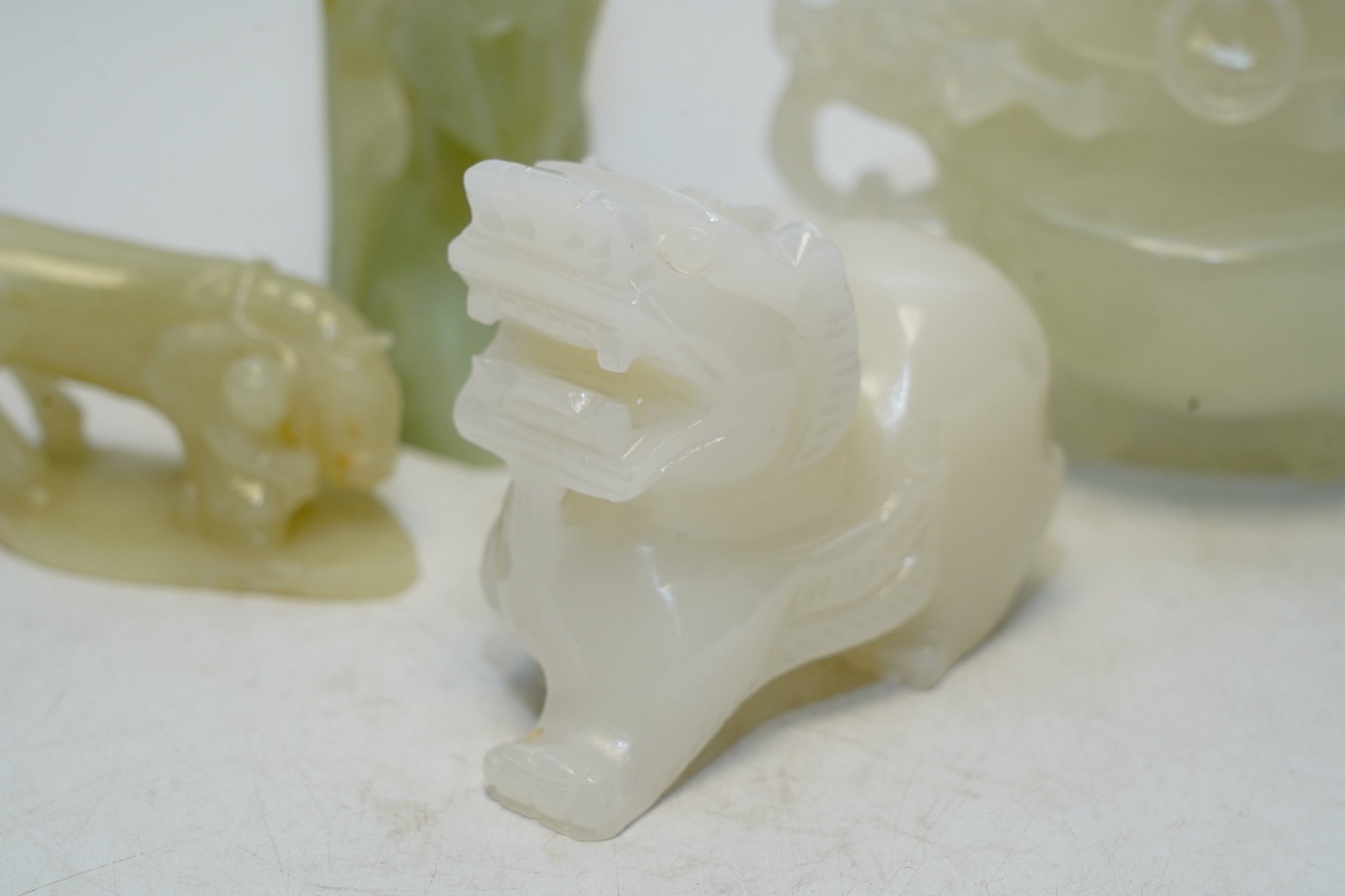 Four Chinese bowenite jade pieces including carving of a bird, largest 20cm. Condition - fair